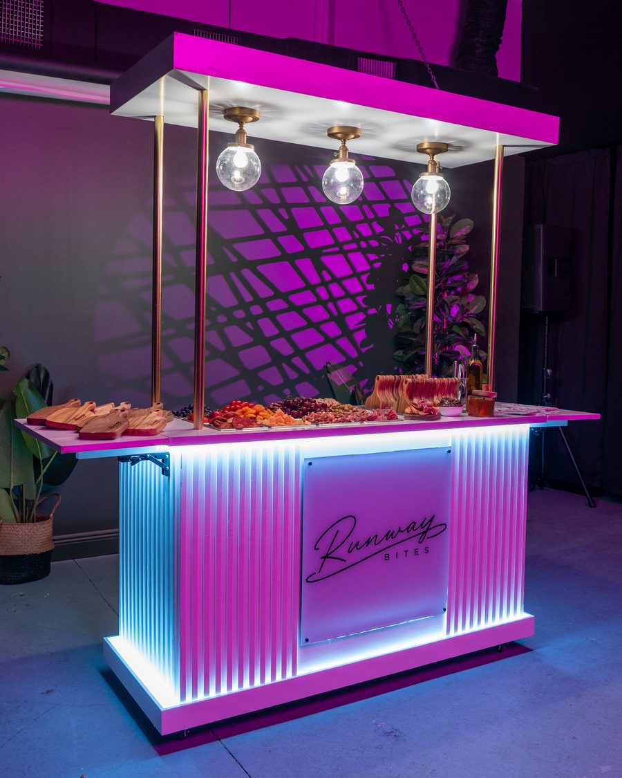 The illuminated Runway Bites grazing cart, styled and set for an event