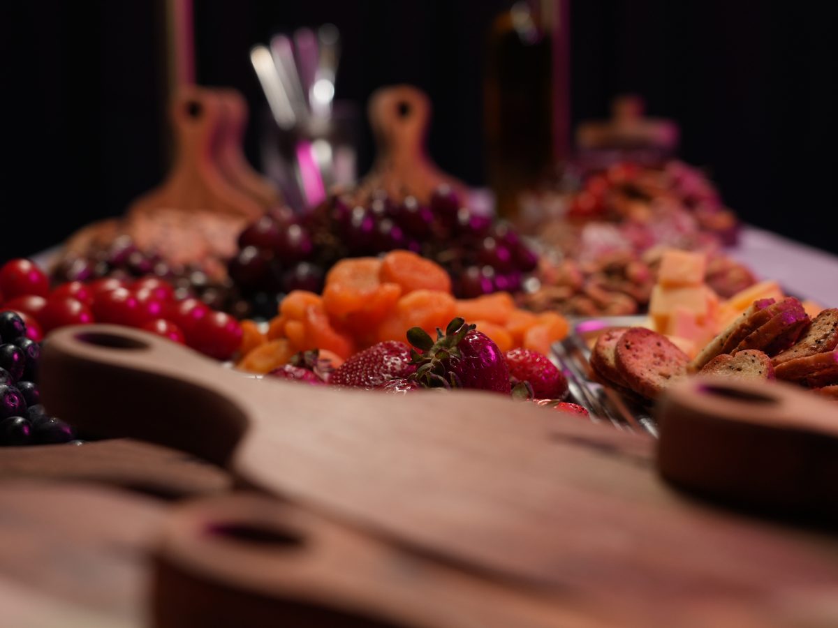 Engraved Runway Bites guest boards stacked beside the spread