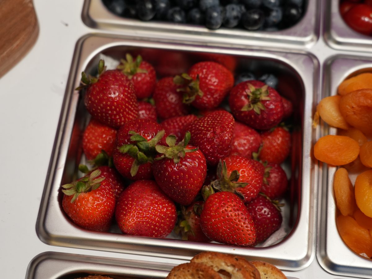 Fresh strawberries and dried apricots on the grazing bar
