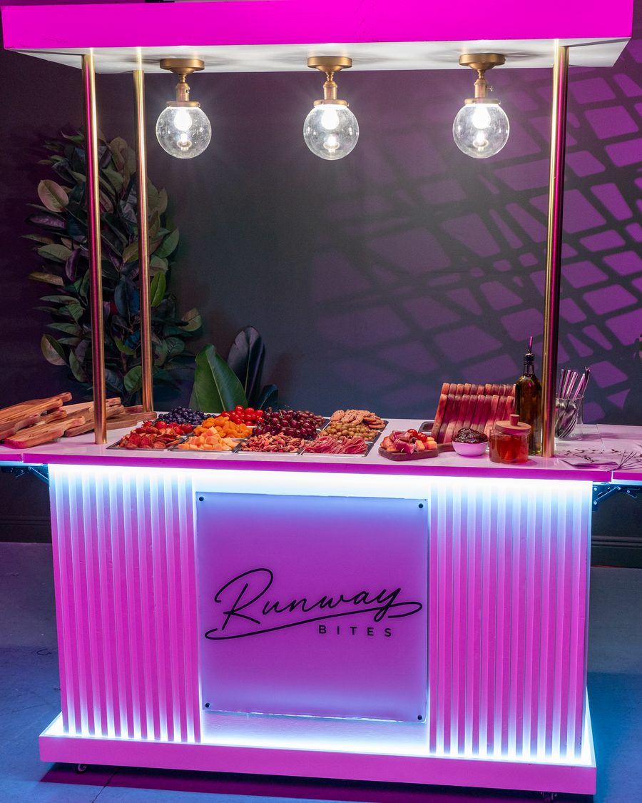 The illuminated Runway Bites grazing bar styled and set for an event